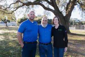 Team members of Diamond Air Design posing outdoors, showcasing HVAC expertise and commitment to quality service.