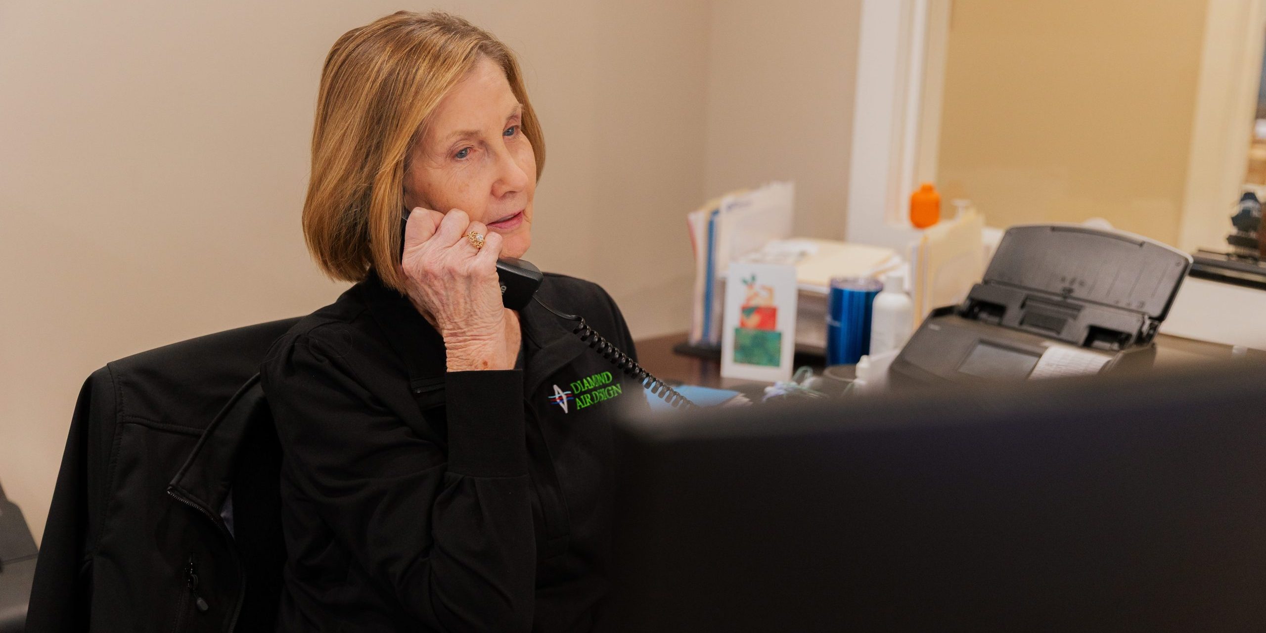 Kay answering the phone